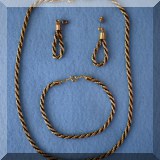 J08. Costume jewelry earrings, necklace and bracelet set. 